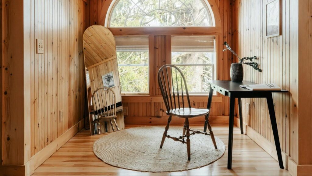room flooded with sunlight thanks to a huge authentic window”